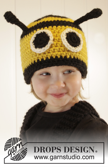 Bee Happy Hat / DROPS Extra 0-1014 - Virkad bi mössa till baby och barn i DROPS Snow. Arbetet virkas med ränder. Storlek 1-8 år.