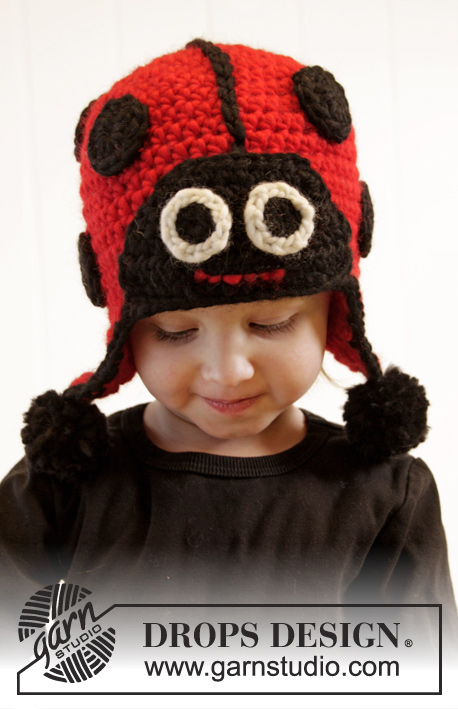 DROPS Extra 0-1015 - Crochet ladybug hat for baby and children in DROPS Snow. Piece is worked with ear flaps and dots. Size 1 - 8 years. 
