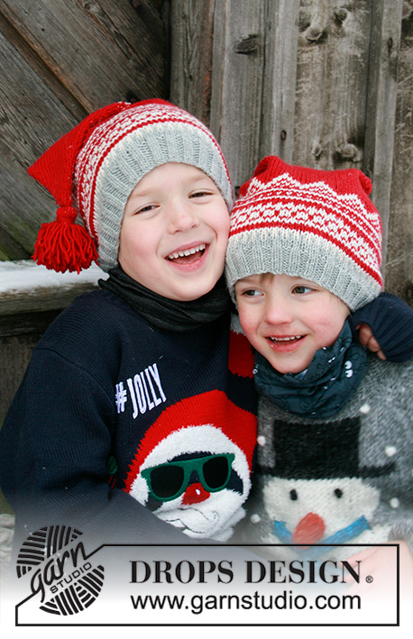Double Trouble / DROPS Extra 0-1428 - Gebreide muts / kerstmuts voor kinderen in DROPS Merino Extra Fine. Het werk wordt gebreid met Scandinavisch patroon en kwasten. Maten 2 – 12 jaar. Thema: Kerst.