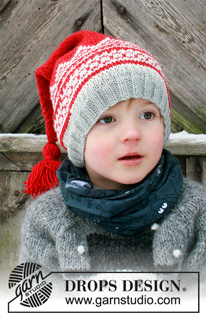 Double Trouble / DROPS Extra 0-1428 - Gorro de criança tricotado / Gorro de Natal em DROPS Merino Extra Fine, com jacquard norueguês e borla. Tamanhos 2 - 12 anos. 
Tema: Natal.