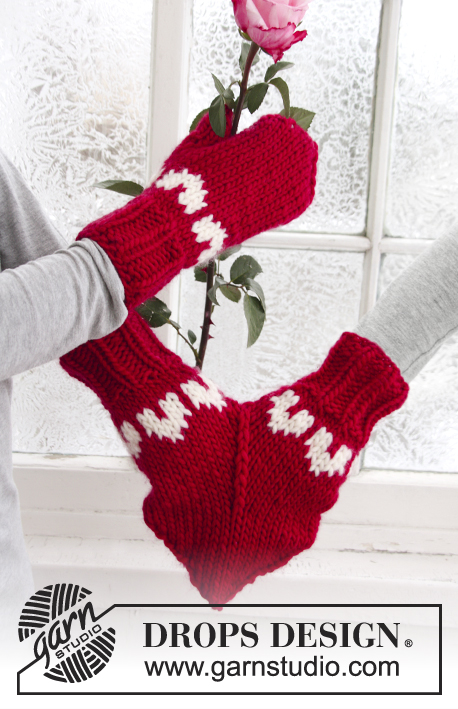 Love Glove / DROPS Extra 0-610 - Manguito o manoplas para mujeres y hombres en DROPS Eskimo. La pieza está tejida con patrón de jacquard con corazones. Tallas S – L. Tema: Navidad.