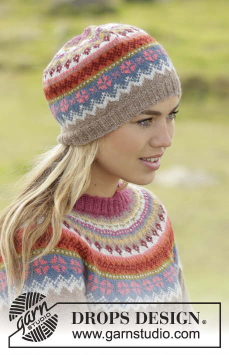 Stavanger / DROPS 173-51 - Set consists of: Knitted DROPS jumper worked top down with round yoke and multi-colored pattern on yoke in ”Alpaca”. Hat with multi-colored pattern in “Alpaca”. Size: S - XXXL.