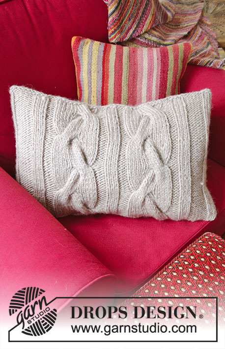 Cozy Cables / DROPS 183-41 - Knitted pillow with cables. The piece is worked in DROPS Snow.