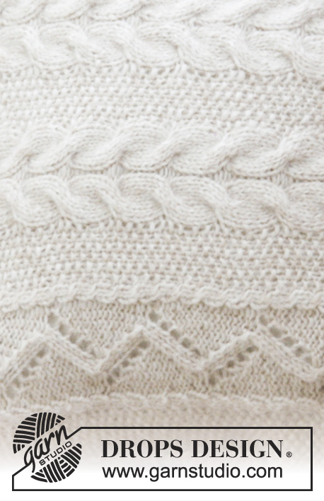 Elegant Comfort Pillow / DROPS 183-42 - Coussin tricoté en DROPS Air, avec point de riz, torsades et point ajouré.