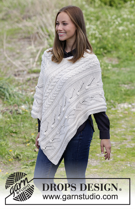 Winter's Heart / DROPS 184-5 - Knitted poncho with cables, bubbles and lace pattern. Sizes S - XXXL.
The piece is worked in 2 strands DROPS BabyMerino.