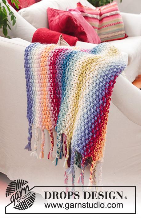 Jalisco / DROPS 189-1 - Knitted rainbow blanket with seed stitch, stripes and fringe. The piece is worked in 2 strands DROPS Snow.