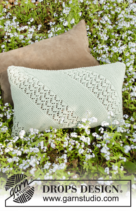 Diandra Pillow / DROPS 198-27 - Knitted pillow with garter stitch and lace pattern in DROPS Cotton Merino. Piece is knitted diagonally. Fits pillow 30 x 50 cm.