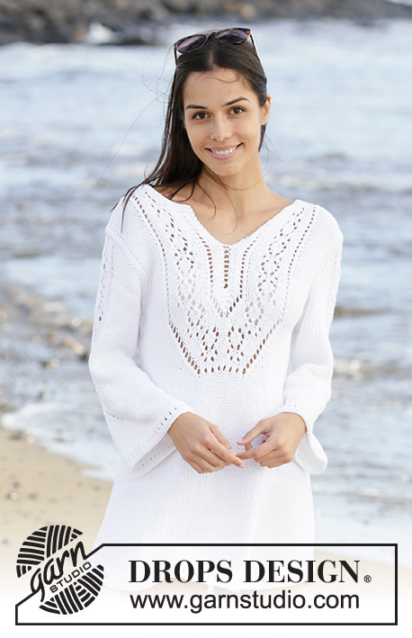 White Pearl / DROPS 199-2 - Knitted dress in DROPS Paris. The piece is worked with lace pattern, split in front of neck and ¾ length trumpet sleeves with lace pattern. Sizes S - XXXL.