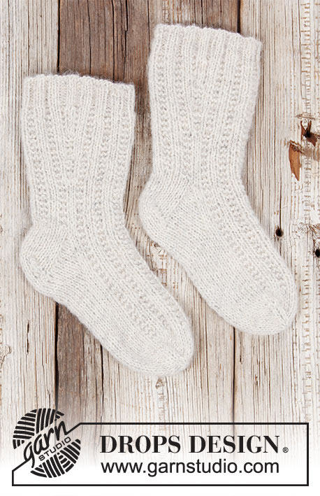 Winter Wanderers / DROPS 203-31 - Gebreide sokken met textuurpatroon in 1 draad DROPS Brushed Alpaca Silk en 1 draad DROPS Fabel. Maat 35-43.