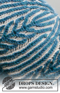 Blue Flake / DROPS 204-27 - Gebreide baret in Engelse patentsteek met 2 kleuren. Het werk wordt gebreid in DROPS Merino Extra Fine.