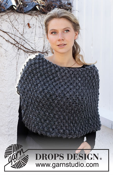 Collecting Pinecones / DROPS 214-47 - Knitted poncho in DROPS Polaris. The piece is worked back and forth in moss stitch. Sizes S - XL.