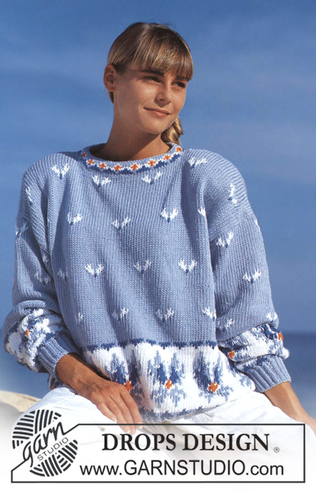 DROPS 22-5 - Sweter na drutach, z żakardem w kwiaty, z włóczki DROPS Paris.