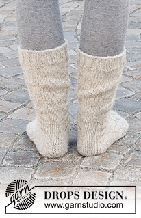 Cable City Socks / DROPS 227-66 - Knitted socks in DROPS Nord and DROPS Brushed Alpaca Silk. The piece is worked with cables, top down. Sizes 35 – 43 = US 4 1/2 – 12 1/2.