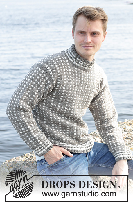 Winter Twilight / DROPS 246-1 - Męski sweter na drutach, z włóczki DROPS Merino Extra Fine. Przerabiany od dołu do góry z żakardem norweskim/islandzkim, podwójnym wykończeniem dekoltu i wszywanymi rękawami. Od S do XXXL.