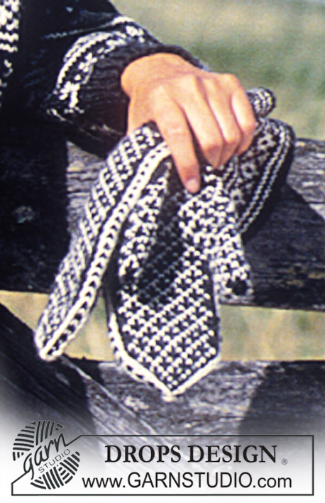 DROPS 32-19 - Sweter lub rozpinany sweter na drutach, z żakardem z włóczki DROPS Karisma Superwash, z brzegiem z tasiemką lub bez. Krótki lub długi. Skarpetki, czapka, opaska i rękawiczki do kompletu. Damski lub męski. Od S do L.