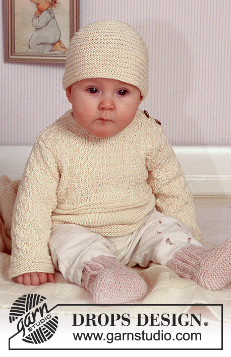 Sweet Molly / DROPS Baby 11-11 - Pulóver con patrón texturado y gorro DROPS en “Safran”, calcetas en “Angora-Tweed” y frazada en “Karisma Superwash”.