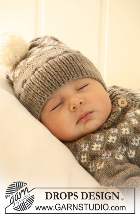 First Snow Hat / DROPS Baby 19-33 - Settiin kuuluu: Vauvan ja lapsen kaarrokejakku korkealla kauluksella, myssy ja kuviolliset sukat DROPS Merino Extra Fine -langasta. 