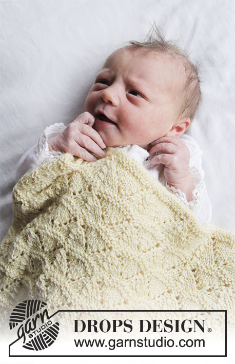 Sunrise / DROPS Baby 33-16 - Vauvan neulottu peitto DROPS BabyMerino -langasta. Työssä on pitsineuletta. Teema: Vauvanpeitto