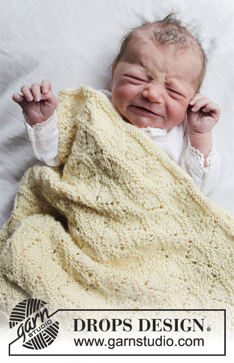 Sunrise / DROPS Baby 33-16 - Vauvan neulottu peitto DROPS BabyMerino -langasta. Työssä on pitsineuletta. Teema: Vauvanpeitto