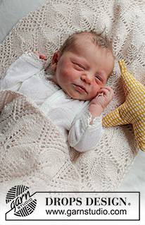 Golden Slumber / DROPS Baby 33-2 - Vauvan neulottu peitto DROPS BabyMerino -langasta. Työssä on lehtikuvioita ja työ neulotaan keskeltä alkaen neliönä. Teema: Vauvanpeitto