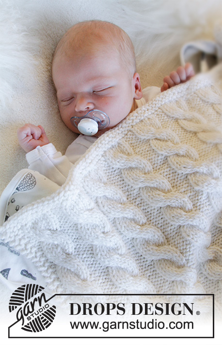 Dream of Cables / DROPS Baby 33-33 - Dětská baby deka s copánky pletená z příze DROPS Big Merino. Motiv: Dětské deky.