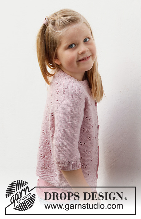 Pink Peony Cardigan / DROPS Baby & Children 38-22 - Dziecięcy sweter rozpinany na drutach, przerabiany od góry do dołu z włóczki DROPS Baby Merino, z rękawami typu saddle shoulder, ściegiem ażurowym i z krótkim rękawem. Od 3 do 14 lat.