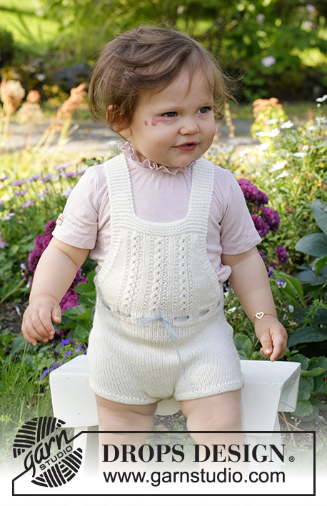 Magic in the Air / DROPS Baby & Children 38-4 - DROPS BabyMerino lõngast ripskoes kootud pitsmustriga ja traksidega lühikesed püksid 1 kuusele beebile kuni 2 aastasele lapsele