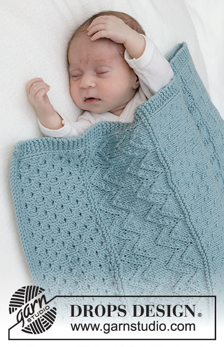 Dot Dot Line Blanket / DROPS Baby 46-3 - Manta tricotada para bebé em DROPS Merino Extra Fine. Tricota-se em idas e voltas com ponto em relevo.