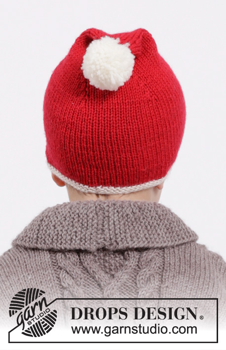 Charming Cooper Santa Hat / DROPS Children 26-18 - Set of knitted hat with pompom and bow in DROPS Karisma or DROPS Lima. Size children 3 - 12 years.