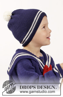 Sailor Aksel / DROPS Children 26-7 - Rozpinany sweter na drutach, z reglanem i odpinanym marynarskim kołnierzem z muszką, skarpetki i czapka z pomponem z włóczki DROPS Merino Extra Fine. Od 2 do 10 lat