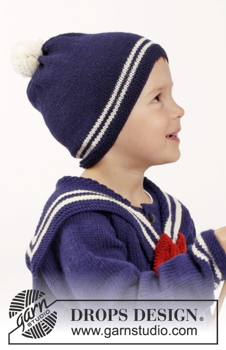 Sailor Aksel / DROPS Children 26-7 - Rozpinany sweter na drutach, z reglanem i odpinanym marynarskim kołnierzem z muszką, skarpetki i czapka z pomponem z włóczki DROPS Merino Extra Fine. Od 2 do 10 lat