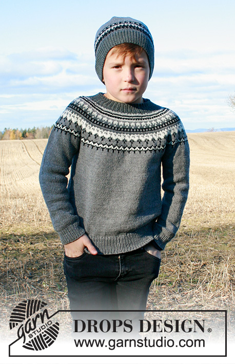 Dalvik / DROPS Children 34-18 - Strikket hue og bluse til børn med nordisk mønster i DROPS BabyMerino. Blusen er strikket oppefra og ned med rundt bærestykke. Størrelse 2-12 år.