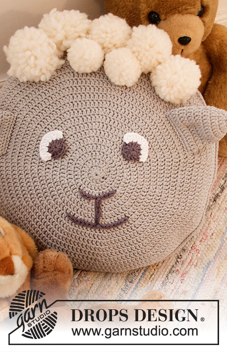 Dolly the Sheep Pillow / DROPS Children 35-2 - Crocheted round pillow case in DROPS Paris and DROPS Snow. Piece is crocheted in the round in a circle and decorated as a sheep.
