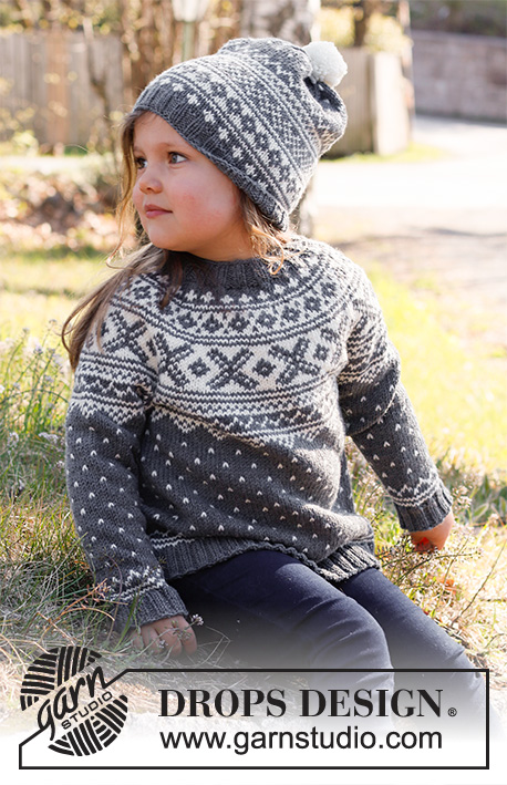 North Star / DROPS Children 37-1 - Dětský pulovr s kruhovým sedlem a norským vzorem pletený shora dolů z příze DROPS Merino Extra Fine. Velikost 2 – 12 let.