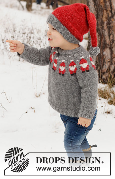 Merry Santas / DROPS Children 41-1 - Dziecięcy sweter / świąteczny sweter i czapka / świąteczna czapka na drutach z włóczki DROPS Air. Sweter jest przerabiany od góry do dołu, z zaokrąglonym karczkiem i żakardem w Mikołaje. Czapka jest przerabiana na okrągło, od dołu do góry. Od 2 do 14 lat. Temat: Boże Narodzenie.