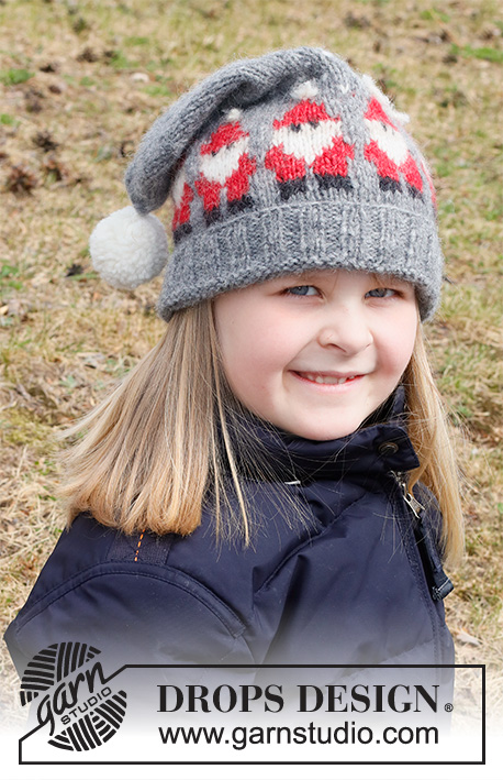 Merry Santas Hat / DROPS Children 41-18 - Cappello per bambini lavorato ai ferri in DROPS Air. Lavorato con motivo con Babbo Natale e pompom. Taglie: 3 – 14 anni. Tema: Natale.