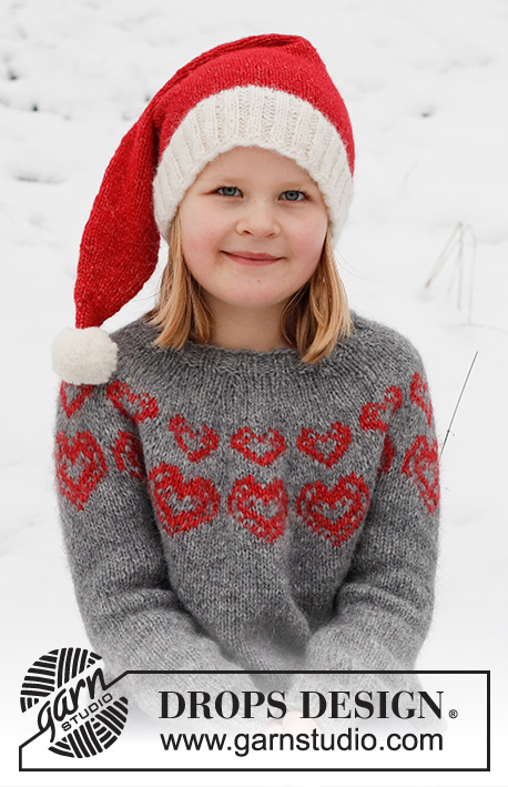 Merry Hearts / DROPS Children 41-3 - Stickad jultröja och tomteluva till barn i DROPS Air. Tröjan stickas uppifrån och ner, med runt ok och hjärtmönster. Mössan stickas i slätstickning med resår. Storlek 2 - 14 år. Tema: Jul.