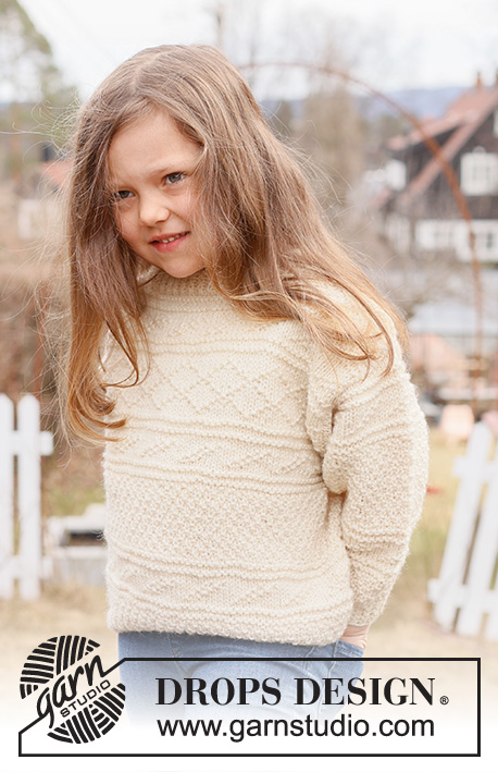 Icing on the Cake / DROPS Children 44-13 - Dětský pulovr pletený zdola nahoru plastickým a perličkovým vzorem z příze DROPS Alaska. Velikost 2 – 12 let.