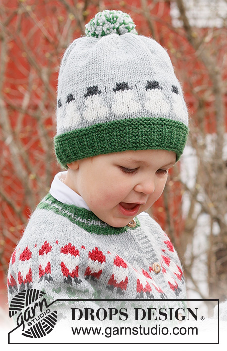 Snowman Time Hat / DROPS Children 44-18 - Dziecięca czapka na drutach, z włóczki DROPS Karisma. Przerabiana od dołu do góry, z żakardem w bałwanki. Od 2 do 14 lat. Temat: Boże Narodzenie.
